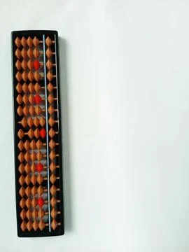 Black plastic abacus with brown and red rows of beads Stock Photos