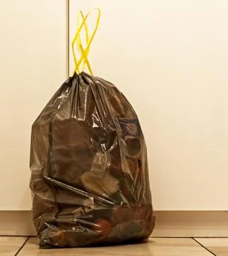 Black plastic bag for bin garbage. Stock Photos