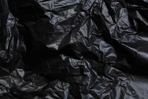 Black plastic bag texture, macro, abstract background Photos