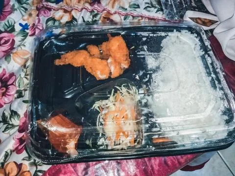 Black plastic box containing a ready meal Stock Photos