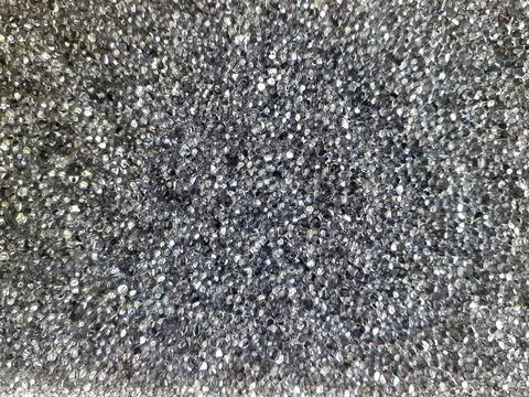 Black plastic bubble background. Massage part of a body wash sponge. Stock Photos