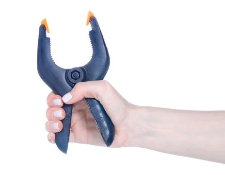 Black plastic clamp in hand Stock Photos