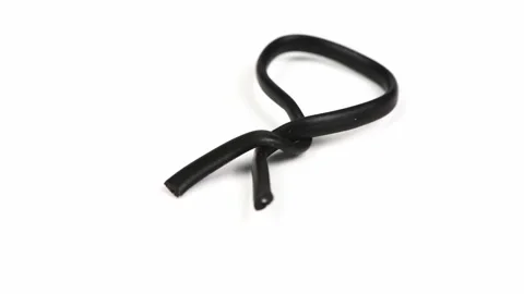 Black plastic coated wire tie used for a variety of things Stock Footage 238497031
