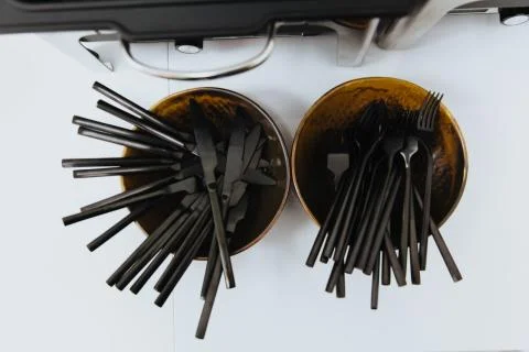 Black plastic cutlery. Stock-Fotos