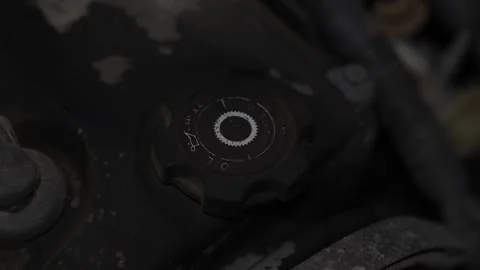 Black plastic engine oil filler cap on car valve cover. Stock Footage 344365726