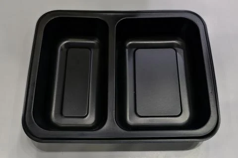 Black plastic food container Stock-Fotos