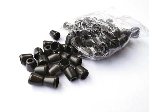 Black plastic jacket strap stopper with white background Stock Photos