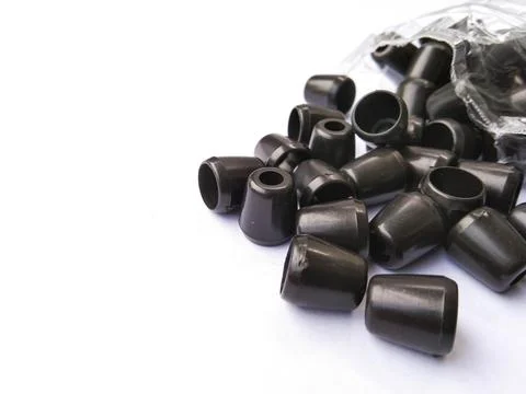 Black plastic jacket strap stopper with white background Stock Photos