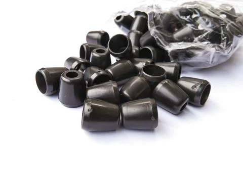 Black plastic jacket strap stopper with white background Stock Photos