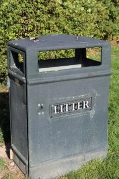 Black plastic litter bin Stock Photos