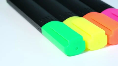 Black plastic markers with colored caps rotate in circle on white background. Cl Stock Footage 247177314