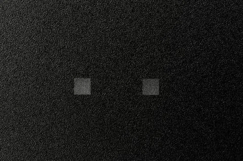 Black plastic matte surface with light indicator squares Stock Photos