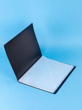 Black  plastic office folder on blue background. Office Folder Template Stock Photos
