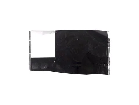 Black plastic packaging fragment with matte and glossy surface, light scuffs. Stock Photos