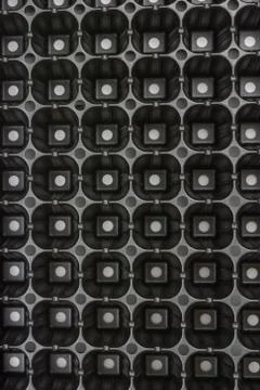 Black plastic pattern abstract squares background plastic Stock Photos