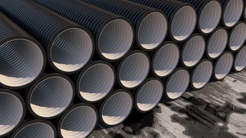 Black plastic pipes are stacked at the construction site. 3d rendering. Stock Footage 286340128