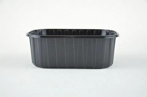 Black plastic PP5 container isolated on a white background, side view Stock Photos