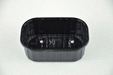 Black plastic PP5 container isolated on a white background, side view Foto stock