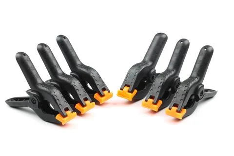Black plastic spring clamp isolated over white background Stock Photos