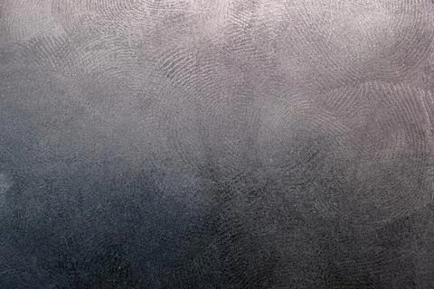 Black plastic surface with multiple fingerprints, macro photo Stock Photos