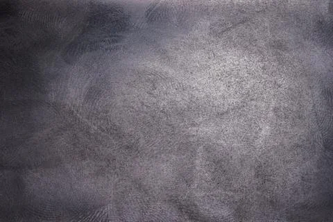 Black plastic surface with multiple fingerprints, macro photo Stock Photos