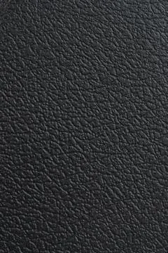 Black plastic texture with leather pattern Stock Photos