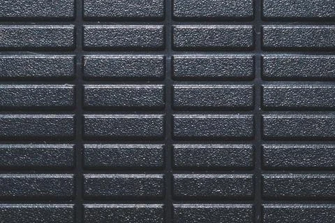Black plastic texture. ribbed pattern. rough surface background Stockfoto's