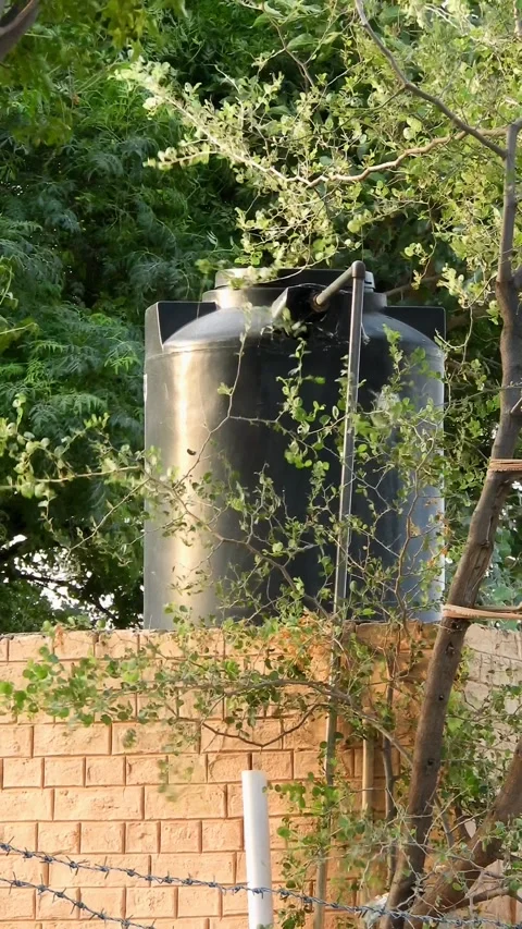 Black Plastic Water Storage Tank Installed On Rooftop  - 4k Vertical Footage Stock Footage 340077762
