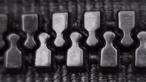 Black plastic zipper on black clothes. Macro Stock Footage 59794004
