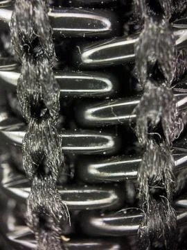 Black plastic zipper under a microscope, macro shot of lightning Fotos de archivo