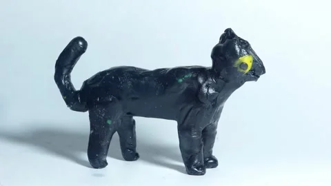 Black plasticine cat dog. Creative children's project from kindergarten. Stock Footage 315245592