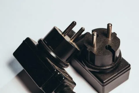 Black plug adapter on a light background Stock Photos