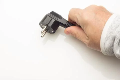 Black plug on colored background Stock Photos