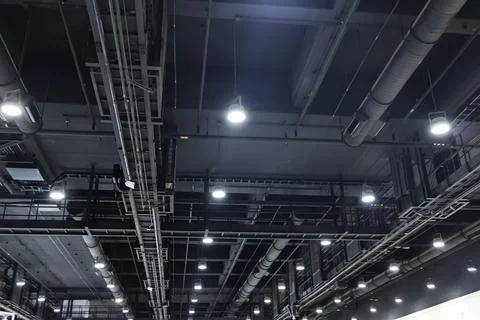 The black plumbing system above the ceiling in a large area includes lighti.. Fotos Stock