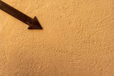 Black pointer on plaster wall Stock Photos