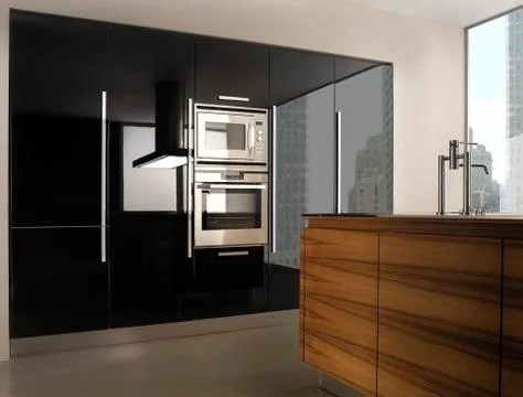 Black polished kitchen system and wood kitchen island copia Stock Photos