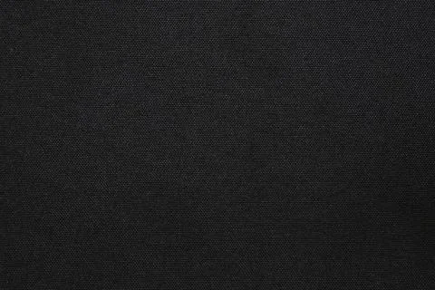 Black polyester fabric texture abstract dark background with fine mesh weave Stock Photos