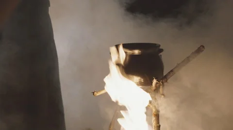 Black pot on the fire Видео 59364571