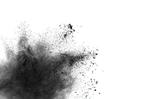 Black powder explosion against white background. Stock Photos