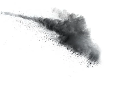 Black powder explosion on white background. Abstract black dust splattered. Stock Photos