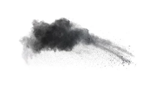 Black powder explosion on white background. Abstract black dust splattered. Stock Photos