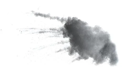 Black powder explosion on white background. Abstract black dust splattered. Stock Photos