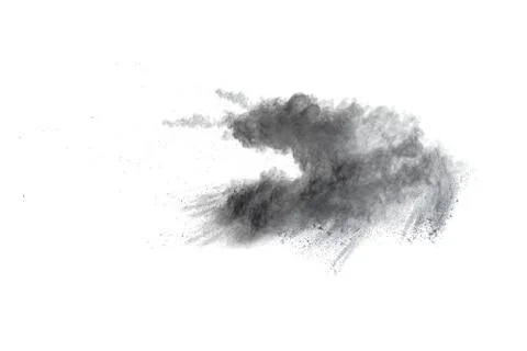 Black powder explosion on white background. Abstract black dust splattered. Stock Photos