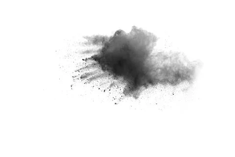 Black powder explosion on white background. Abstract black dust splattered. Foto stock