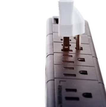 A black power strip with empty outlets Stock Photos