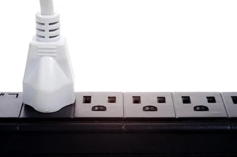 A black power strip with empty outlets Stock Photos