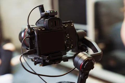 A black professional camera for capturing holidays and family events. Stock Photos