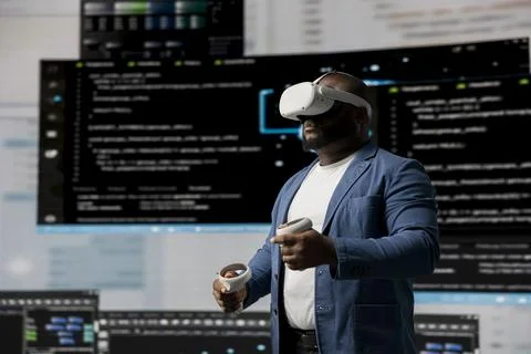 Black professional engineer engaging in virtual reality with glasses Stock Photos
