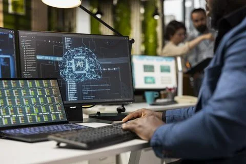 Black professional uses artificial intelligence and machine learning algorithms Stock Photos