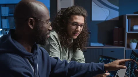 Black Programmer Discussing Software Development with Caucasian Web Engineer Stock Footage 329617028